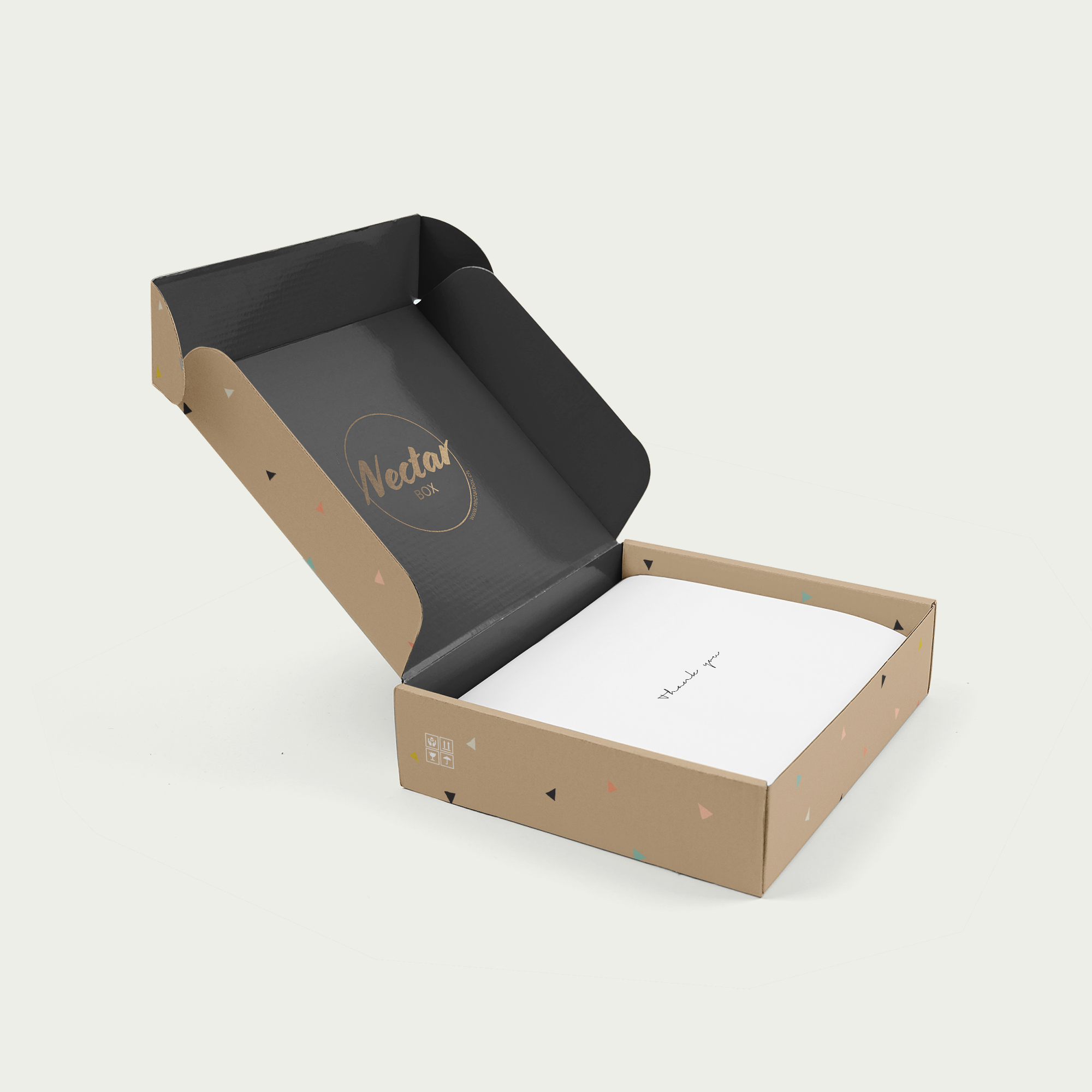 An open Nectar Box mailing box, kraft outside and black inside, with the gold mark on the lid